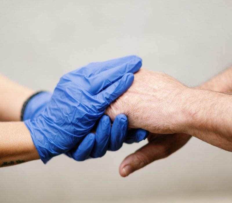 Hands preparing a meal in a bright kitchen.