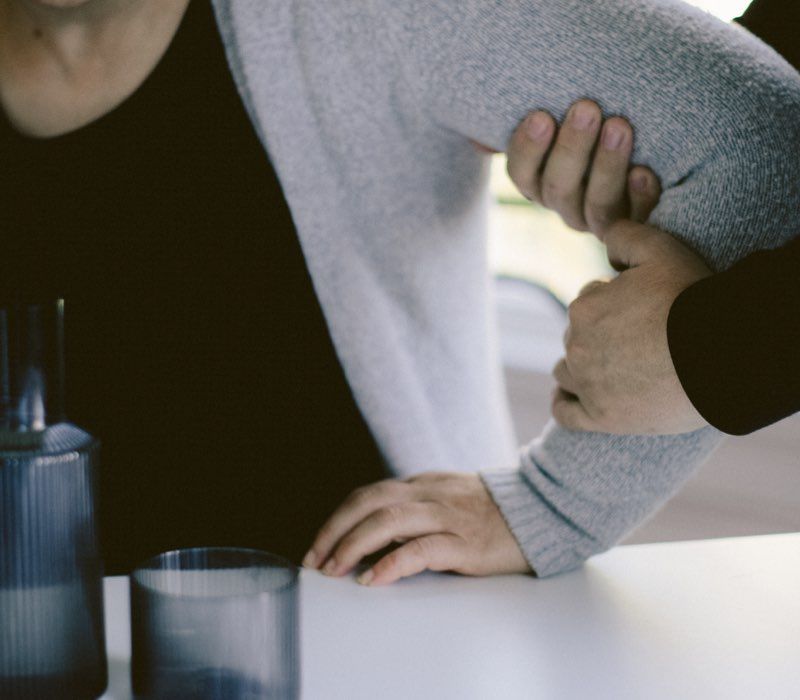 A caregiver assisting a participant with a daily task.